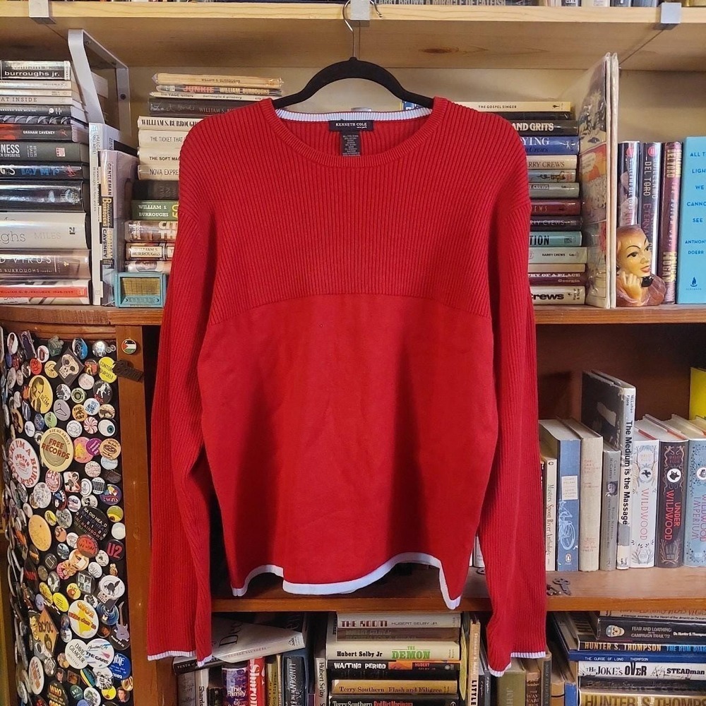 Vintage red sweater with a light blue detailing on the hemline and sleeves.